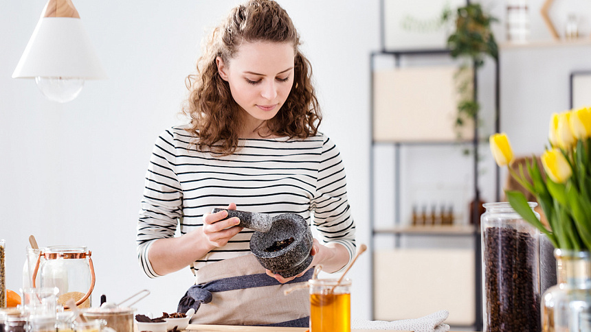 girl grinding spices photo