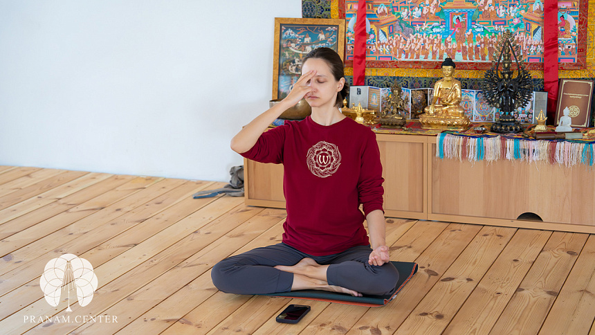 Girl doing Anuloma-viloma-pranayama photo
